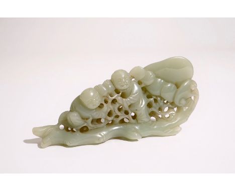 A Chinese pale celadon jade group of boys on a lingzhi, 19th C.  Dim.: L.: 14 cm - W.: 3 cm - H.: 6,5 cm  Condition reports a