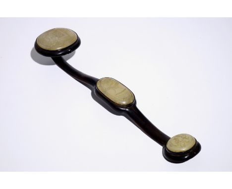 A large Chinese hardwood ruyi sceptre with carved jade panels, 20th C.  L.: 49 cm  Condition reports and high resolution pict