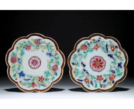 A pair of Chinese famille rose relief-decorated teapot stands, Yongzheng  Dia.: 16 cm  Condition reports and high resolution 
