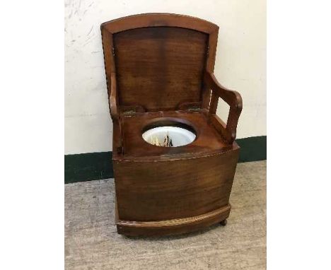 A mahogany commode armchair 