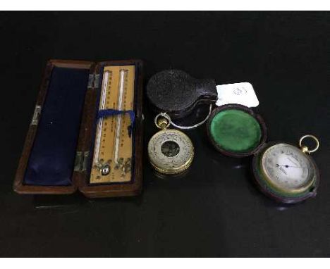 Two pocket compensated barometers, in original cases, together with a maximum minimum thermometer set in case by Negretti & Z