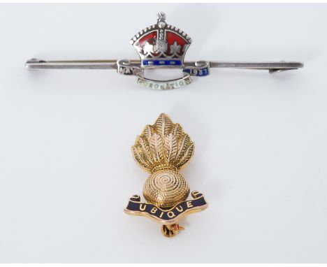 A 9ct yellow gold &amp; black enamel Ubique Military badge, 4.7gm and a silver metal &amp; enamel George V coronation brooch 