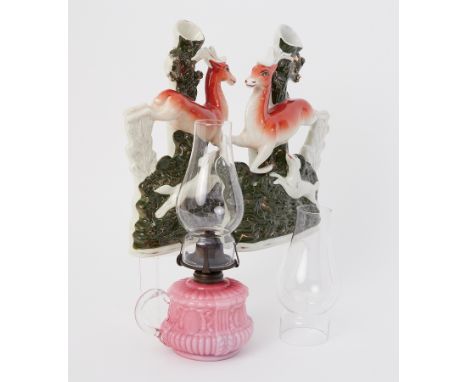 A pair of Staffordshire figures together with a small Victorian chamber glass lamp.