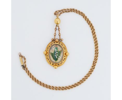 A Victorian pinchbeck Etruscan style pendant set centrally with an oval glass panel with raised lily of the valley flowers in