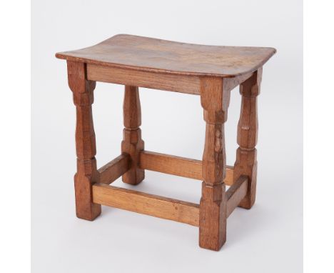 An oak stool, on four octagonal legs joined by stretchers, with carved mouse trademark, height 37cm. Probably Robert 'Mousema