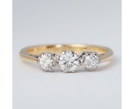 An 18ct yellow gold &amp; platinum three stone ring set with three old round brilliant cut diamonds, total diamond weight app