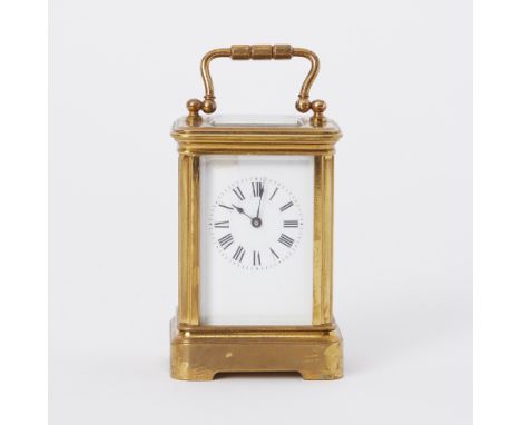 A miniature carriage clock, 10cm handle up, cased.