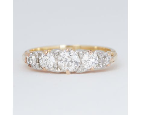 An antique 18ct yellow gold five stone graduated ring set with five old round brilliant cut diamonds, total diamond weight ap