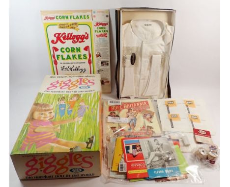 A box of vintage packaging items including Ideal Giggles cardboard doll box, Golden Syrup tins, tobacco tins, Rochester dress