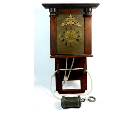 An antique verge escapement hooded wall clock with engraved brass face, mounted in later case