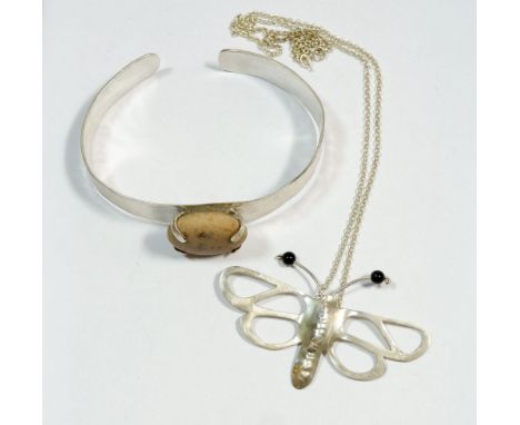 A craft made hammered silver bangle set stone and a silver butterfly pendant 7.5cm wide on silver chain 