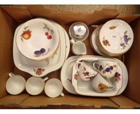 A group of Royal Worcester Evesham to include six cups and saucers, milk and sugar, six dinner plates, five side plates, six 