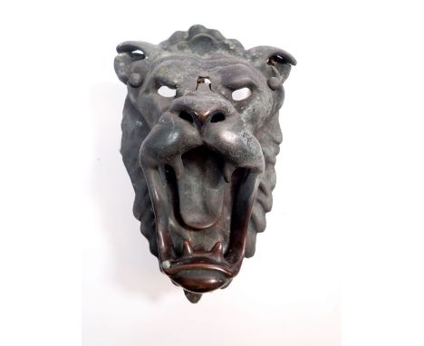 A Victorian cast metal large lion mask door knocker, 21cm long 