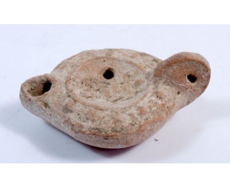 A small Roman pottery oil lamp, 11cm 