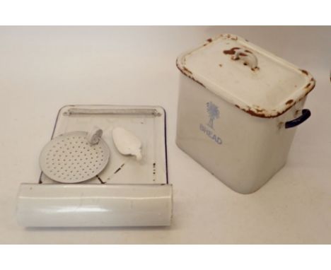 A vintage enamel French wall mounted utensil rack together with an enamel bread bin etc. 