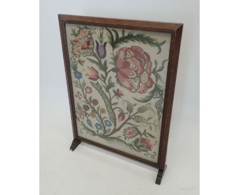 An embroidered fire screen, 73cm tall 