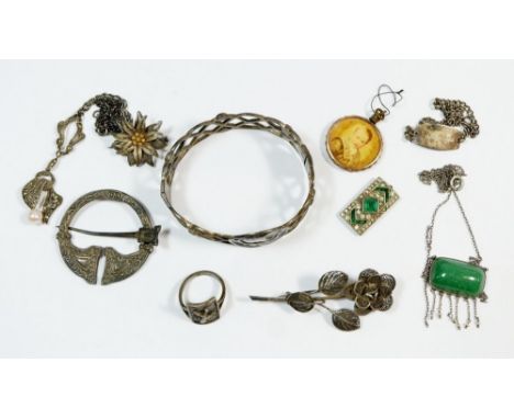 A box of jewellery to conclude a silver bangle by Joseph Cook &amp; Sons, a silver kilt pin, an Art Deco green stone pendant 