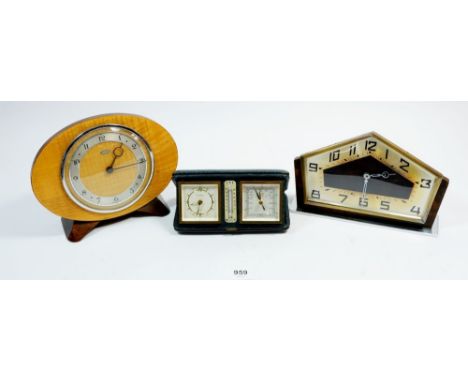 A vintage Metamec mantel clock 19cm wide plus another and a travel combination alarm featuring a thermometer and barometer 