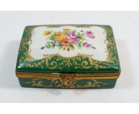 A Limoges green floral painted trinket box, 13cm wide 