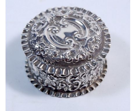 A silver circular trinket box with embossed decoration, Birmingham 1901 