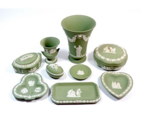 A collection of nine Wedgwood green Jasperware items including trinket boxes and vase, 15.5cm tall 