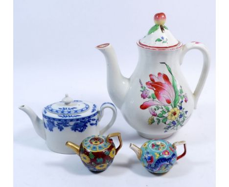 A collection of four teapots including a K G Luneville France example, 22cm high, a smaller Mintons blue and white example an