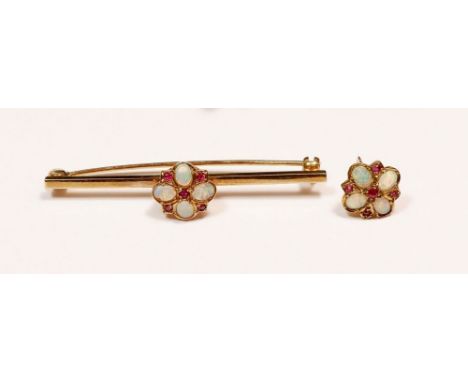 A 9 carat gold opal and ruby bar brooch, boxed and one earring, total weight 4.2g 