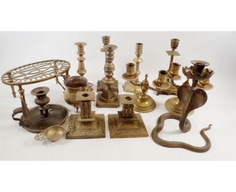 A quantity of brass candlesticks, chamber stick and snake candlestick 