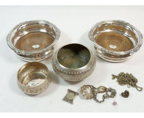 A pair of silver plated and wooden bottle coasters, two Indian white metal embossed bowls, caddy spoon etc 