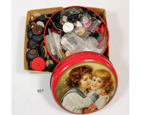 A tin and box of vintage buttons 