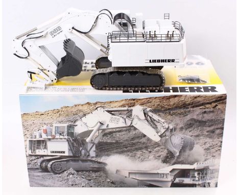 A Conrad 1/50 scale No. 2916 Liebherr 996 Litronic hydraulic excavator, housed in polystyrene pictorial card sleeve