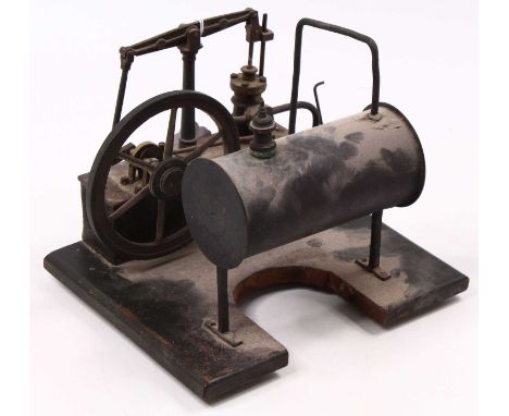 Early 20th century horizontal spirit fired beam engine, comprising raised tin boiler with take off, powering a single cylinde
