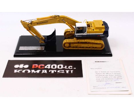 A Euro Hobby Komatsu 1/50 scale limited edition PC400 Tracked Backhoe in dark blue, white and tan body, with dark yellow trac