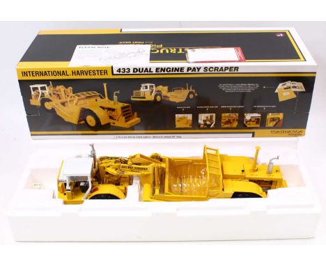 A First Gear 1/25 scale construction Pioneer No. 70-0180 International Harvester 433 dual engine pay scraper housed in a poly