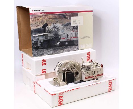An O&amp;K Terex 1/50 scale RH340 hydraulic mining excavator housed in polystyrene with a pictorial card sleeve
