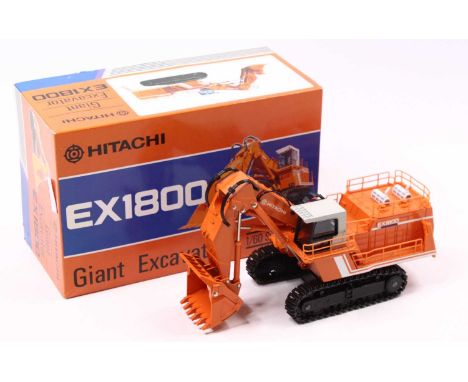 A Hitachi 1/60 scale EX1800 Giant Tracked Excavator of the usual colourway with a blue figure, housed in a polystyrene packed
