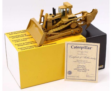 A Conrad limited edition 1/50 scale No. 285 Caterpillar D11N Dozer with impact ripper and metal tracks, housed in polystyrene