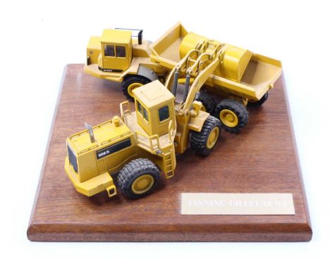 Two 1/50 scale Conrad models on a plinth, to include; No. 2862 Caterpillar D400 Dump Truck, and Caterpillar No. 988 Wheel Loa