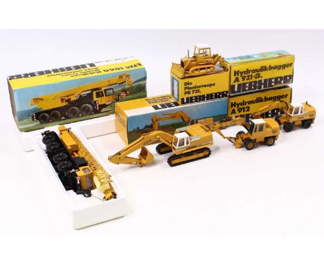 A Conrad and Gescha 1/50 scale Liebherr construction vehicle diecast group of five to include No. 2826 hydraulic excavator R9