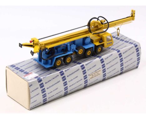A Conrad 1/50 scale diecast model of a No. 2076 Wirth Truck Mounted Water Well Drill with a yellow cab, matching hubs, drill 