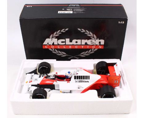 A Minichamps 1/12 scale boxed model of a McLaren Honda MP4 by A Prost 1988, housed in a polystyrene packed box