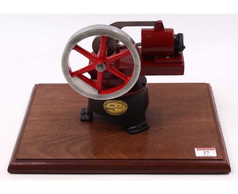 A.E and H Robinson Size B4 Stationary hot air Stirling cycle engine finished in red and fully raised on wooden display plinth