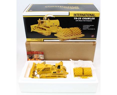 A First Gear 1/25 scale diecast model of an International TD-25 crawler, with a sheep foot compactor, (missing operator's man