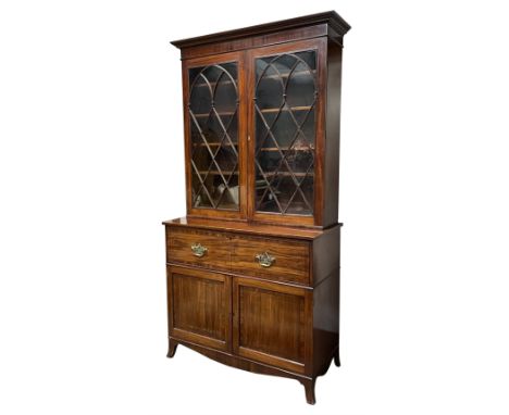 Georgian mahogany secretaire bookcase, projecting moulded and dentil cornice over two Gothic arch astragal glazed doors, reed