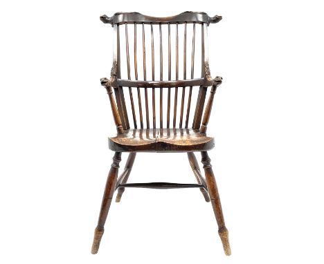 Unusual 19th century elm and beech high comb back Windsor armchair, the serpentine cresting rail carved with serpent heads ov