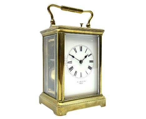 Early 20th century brass carriage clock with repeater, white enamel dial signed ‘Wilkinson, Paris’, twin train movement strik