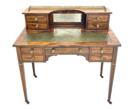 Late Victorian inlaid rosewood writing desk, the raised back fitted with ornate gilt metal gallery, bevelled mirror and four 