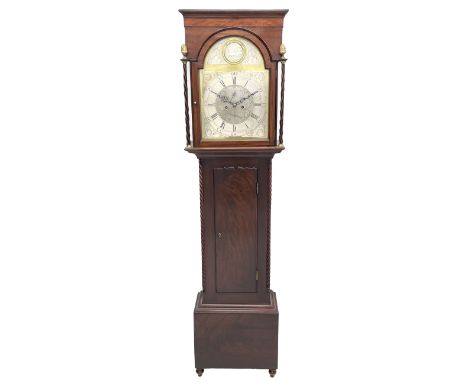 Early 19th century mahogany longcase clock, projecting cornice over a raised satinwood inlaid frieze, stepped arch glazed doo