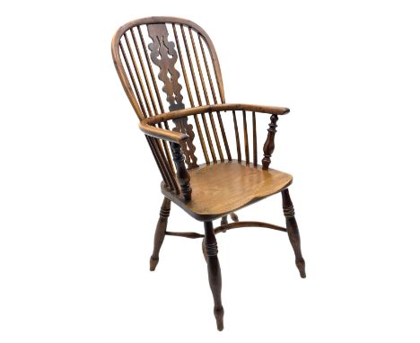 Early 19th century elm and yew wood double hoop Windsor armchair, high stick and pierced splat back, turned supports joined b