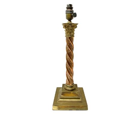 Early 20th century brass and copper Corinthian column table lamp, the square stepped brass base leading to a spiral twist cop